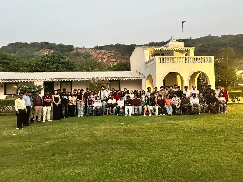 A group gathering on the lawns at Farm Aravalia